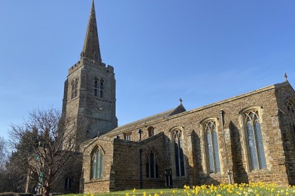 Byfield church with daffodils in the foreground 